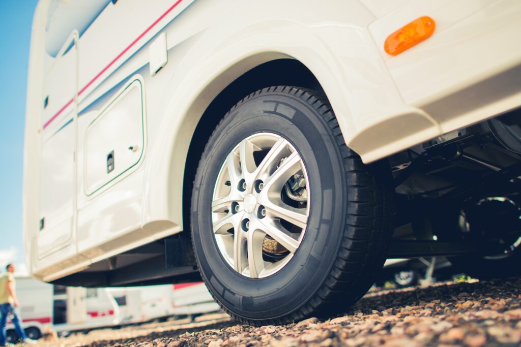 A motorhome with a new tire. 