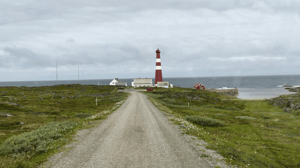 The Slettnes fyr with a dark sky in the background. Slettnes is seen as the unofficial North Cape as it is the most northern point on the mainland.